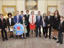 Tim Peake KG5BVI/GB1SS, poses with British PM Theresa May (center), and youngsters from schools involved with Peake's Principia Mission. Jessica Leigh, M6LPJ, is second from right in the photo.